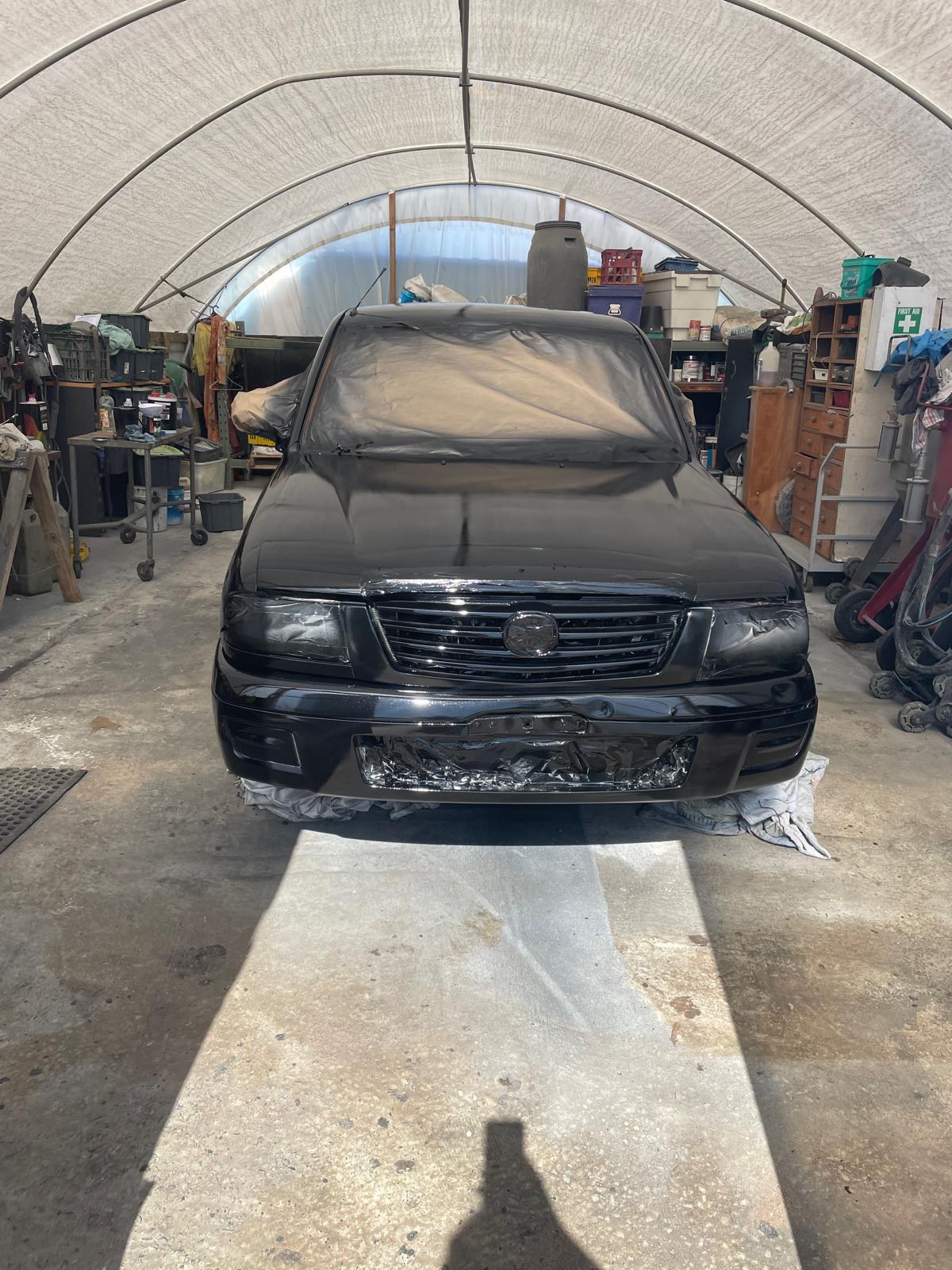 Closed-door respray finished in black