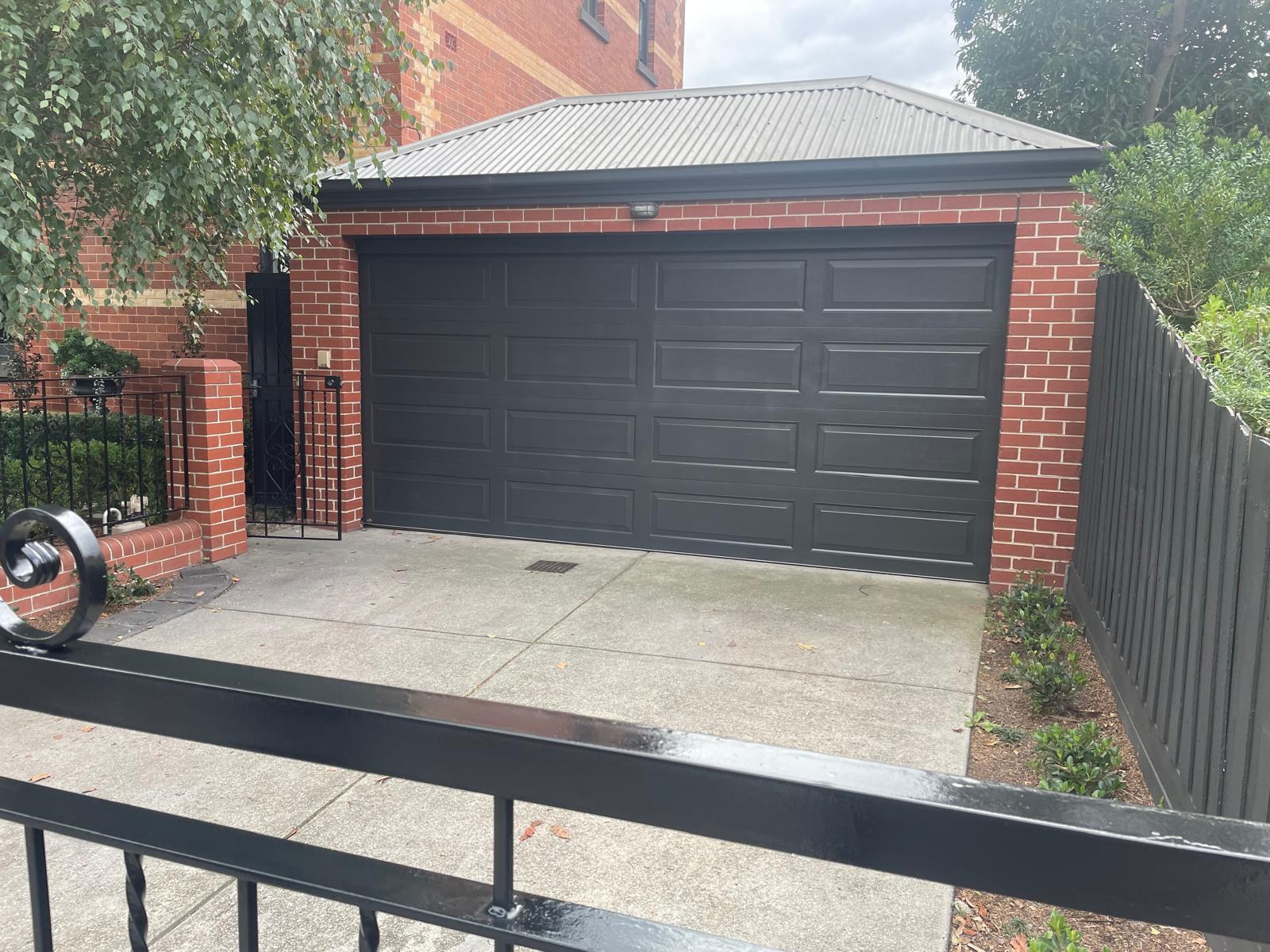 Garage door finished in a dark charcoal respray