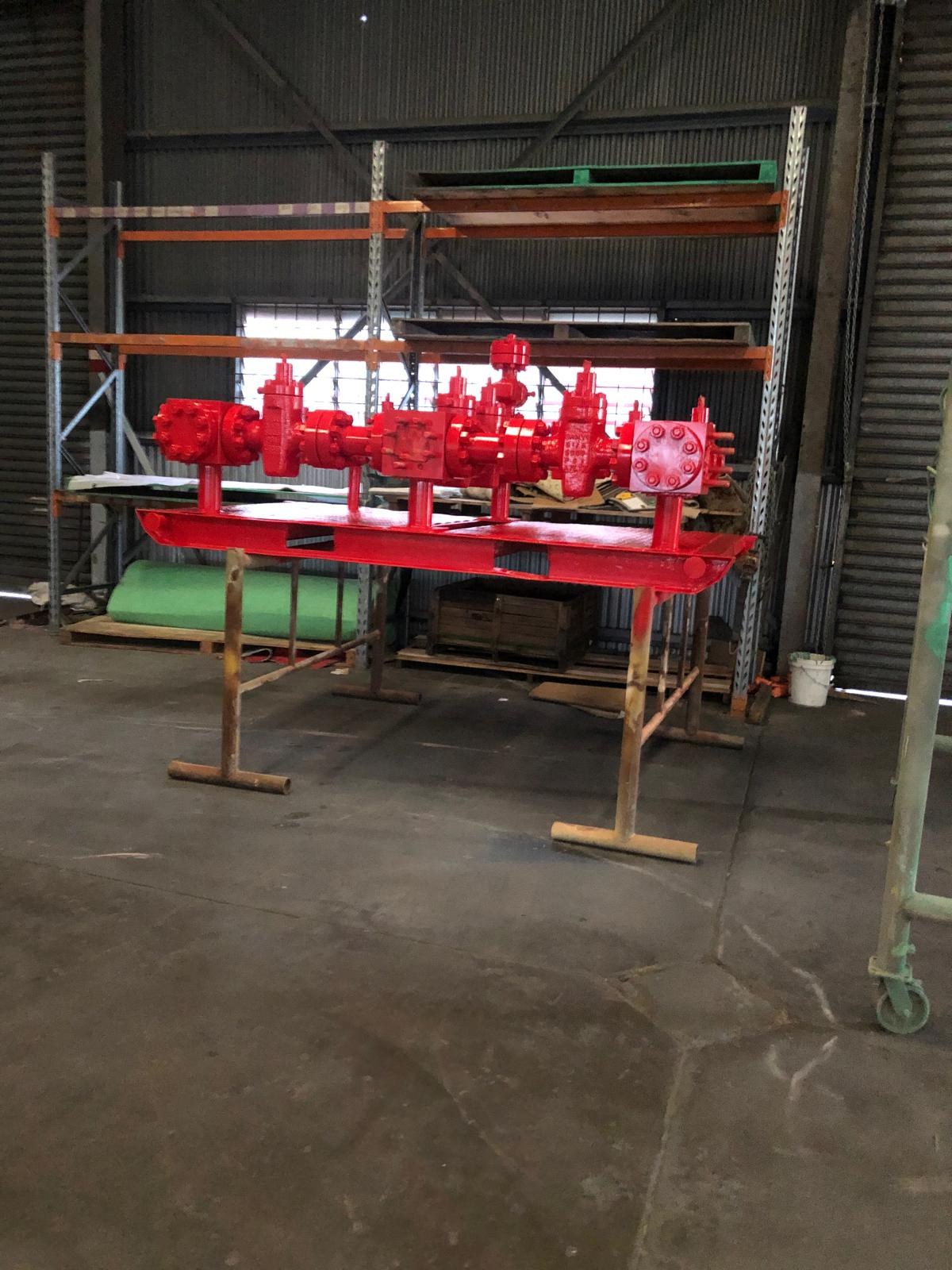 Industrial valve manifold finished in a red protective coating